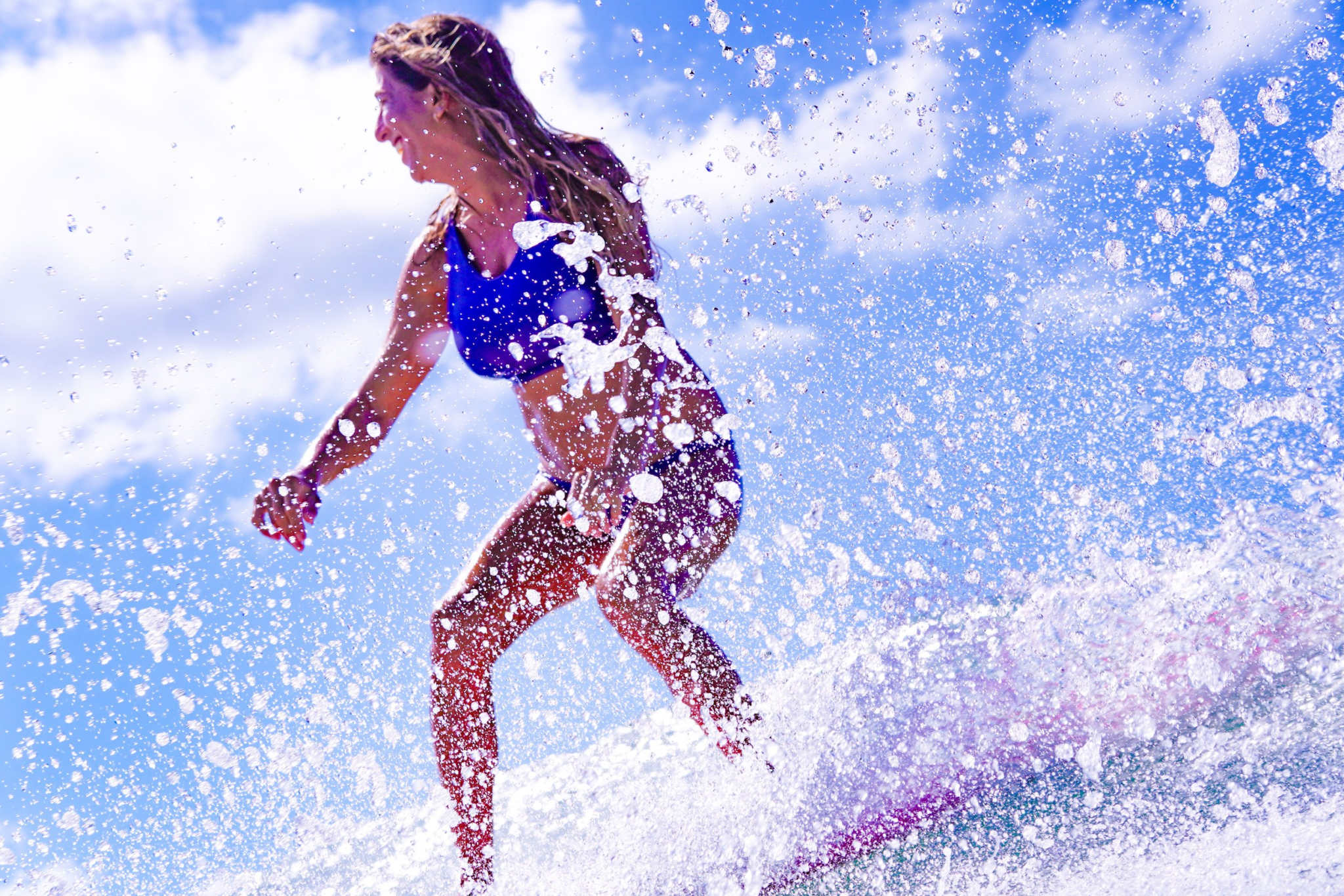 Rima Danielle surfing — licensed therapist who lives what she teaches