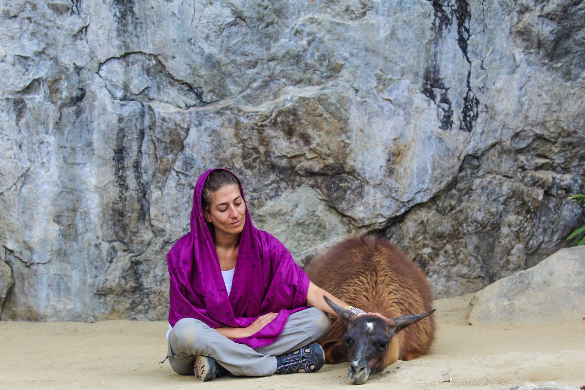 Rima Danielle with a llama at Machu Picchu, Peru — adventurer and therapist